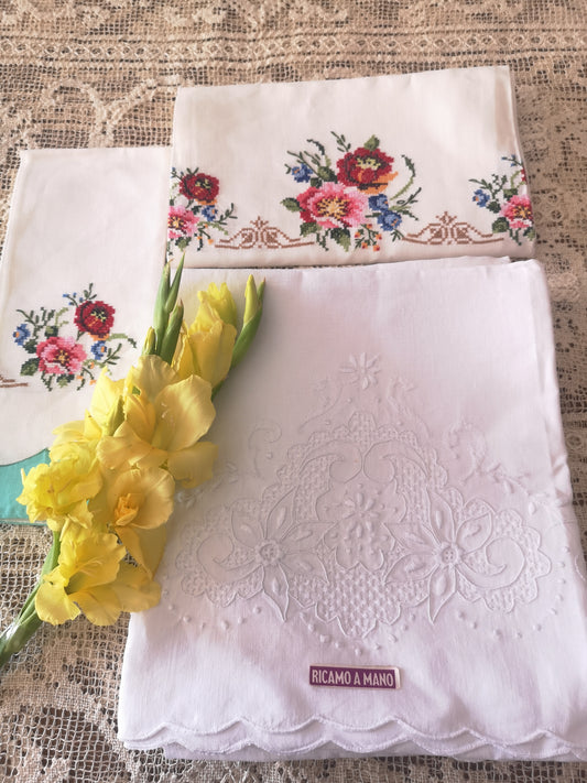 Set of 7 linen towels, including 2 beautifully cross-stitched pieces. Each towel is entirely hand-embroidered.